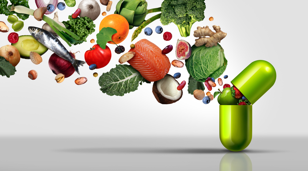 fruit vegetables nuts nutrients, and beans inside a nutrient pill
